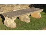 A vintage composition stone bench