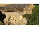 A vintage composition stone bench