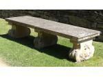A vintage composition stone bench