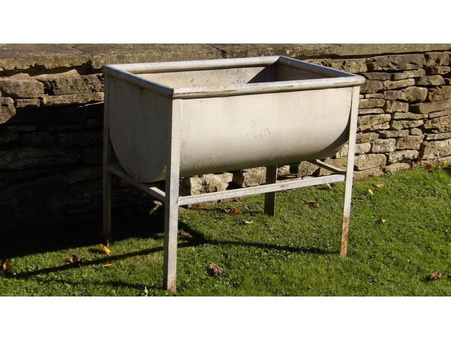 A vintage galvanised trough on stand