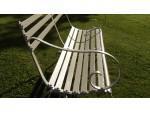Side view of antique wrought iron garden bench