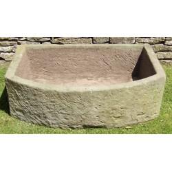 A Large Bow Fronted Stone Trough