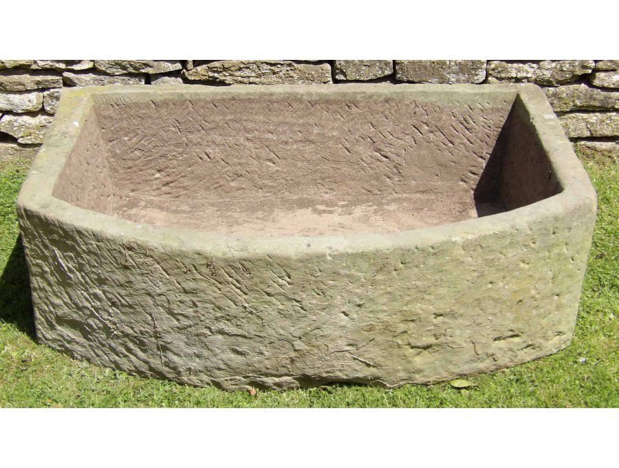 A Large Bow Fronted Stone Trough