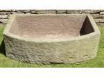 A Large Bow Fronted Stone Trough