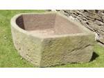 A Large Bow Fronted Stone Trough