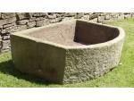A Large Bow Fronted Stone Trough