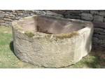 A Large Bow Fronted Stone Trough