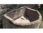 A Large Bow Fronted Stone Trough