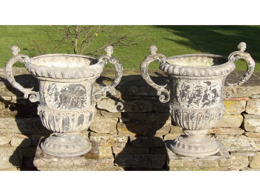 Pair of antique lead urns