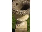 A pair of weathered garden urns