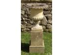 A pair of weathered garden urns