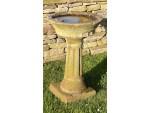Side view of antique garden birdbath 