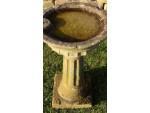 Side view of antique garden birdbath 