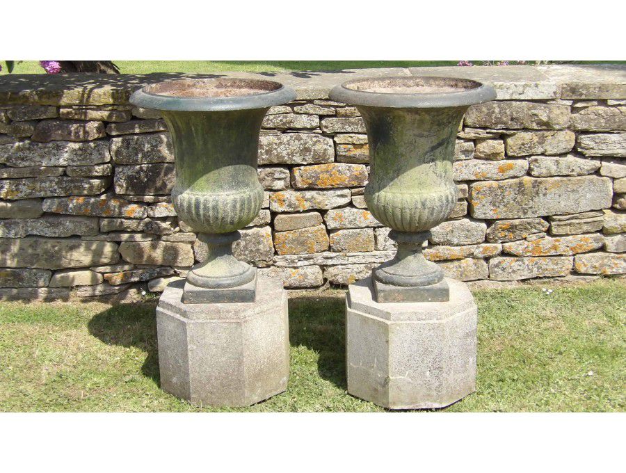 Face on view of antique garden urns 