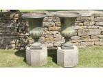 Face on view of antique garden urns 