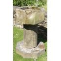 Side view of stone font 
