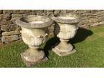 Side view of weathered garden urns
