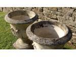 rims of weathered garden urns