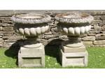 A Pair of Weathered Haddonstone Urns