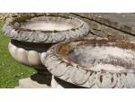 A Pair of Weathered Haddonstone Urns