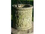 Carved stone well head