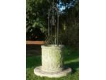 Carved stone well head