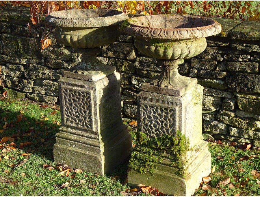 Weathered Urns on Plinths (Pair)