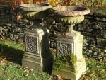 Weathered Urns on Plinths (Pair)
